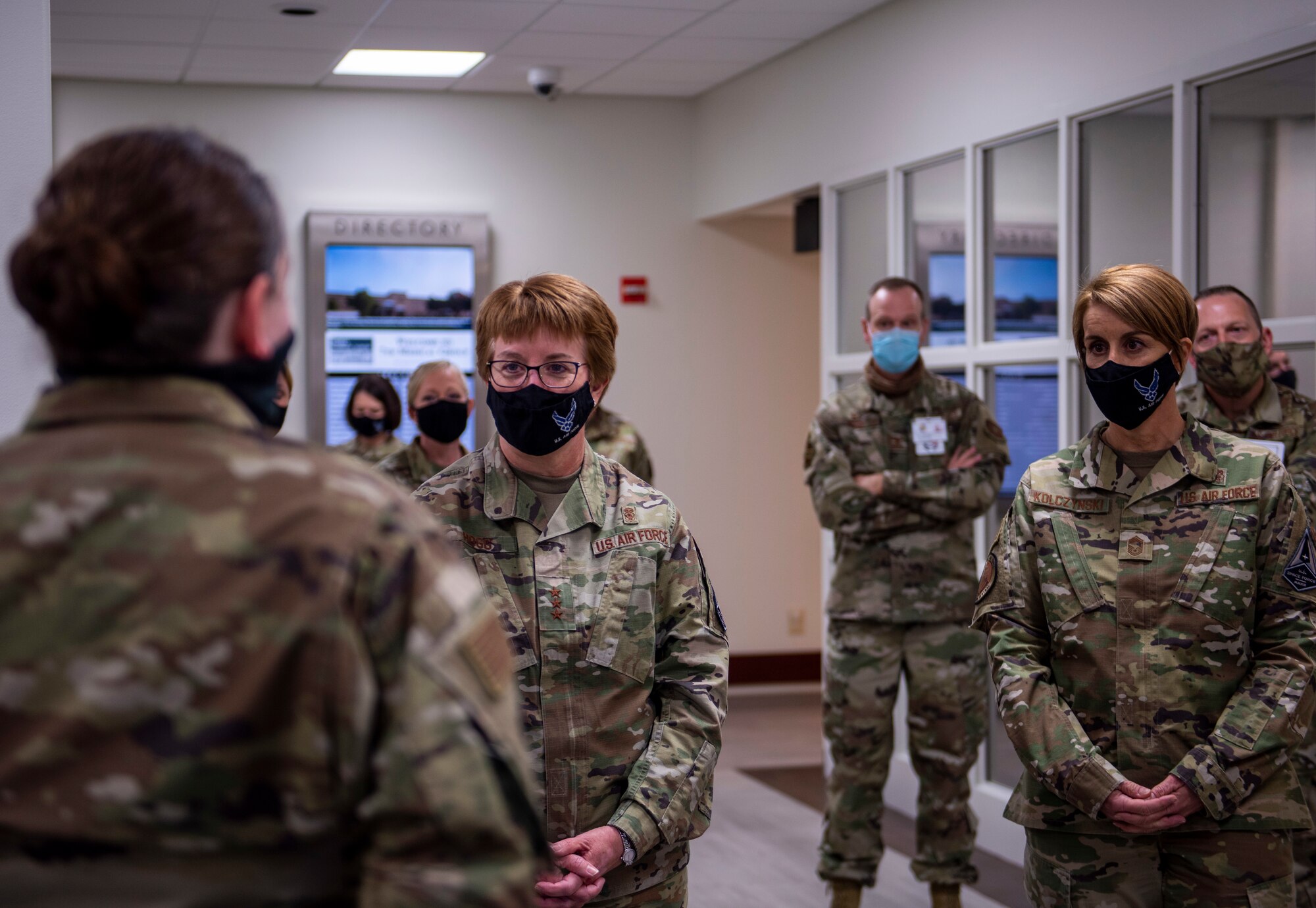 Staff Sgt. Samantha Orosco, 7th Medical Operations Squadron NCO in charge of education and training, speaks with Lt. Gen. Dorothy Hogg, Air Force Surgeon General, middle, and Chief Master Sgt. Dawn Kolczynski, Chief, Medical Enlisted Force and Enlisted Corps Chief, right, about their flight’s practices at Dyess Air Force Base, Texas, Dec. 3, 2020.