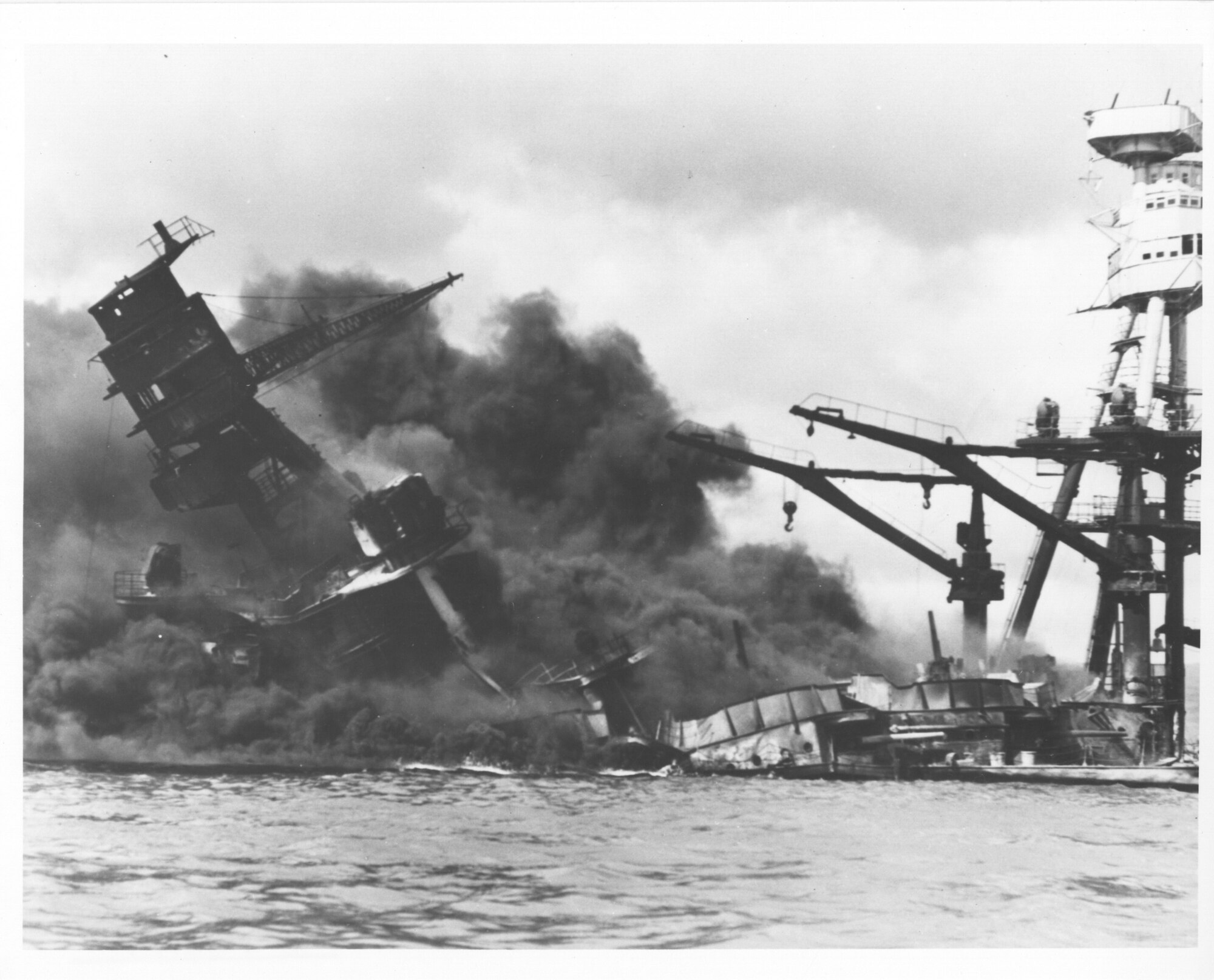 Original caption: Burning and damaged ships at Pearl Harbor, Dec. 7 1941. Photo courtesy of the U.S. National Archives and Records Administration.