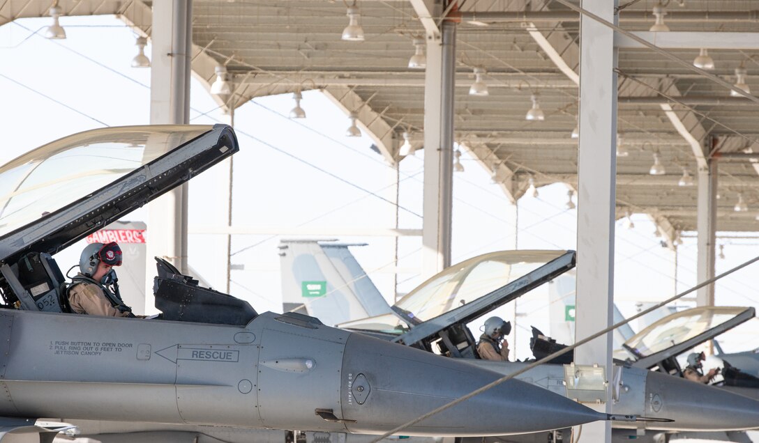 Pilots assigned to the 77th Expeditionary Fighter Squadron prepare for a flying sortie Dec. 1, 2020, at King Faisal Air Base, Kingdom of Saudi Arabia.