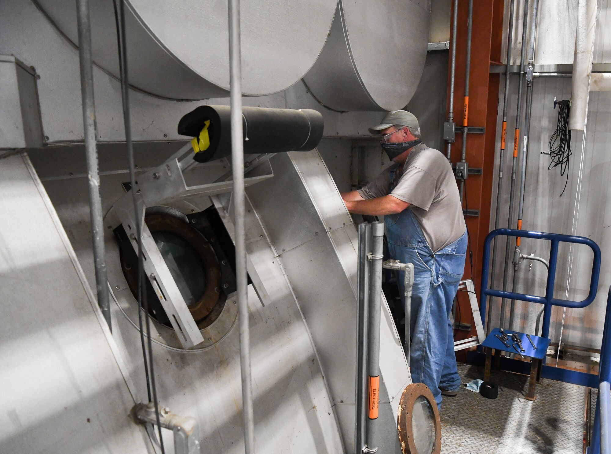 David Amonette, a boilermaker, works on a porthole of the test cell, July 28, 2020, in the J-6 Rocket Motor Test Facility at Arnold Air Force Base, Tenn. The facility allows for the ground test and evaluation of solid-propellant rocket motors at simulated altitudes. (U.S. Air Force photo by Jill Pickett)