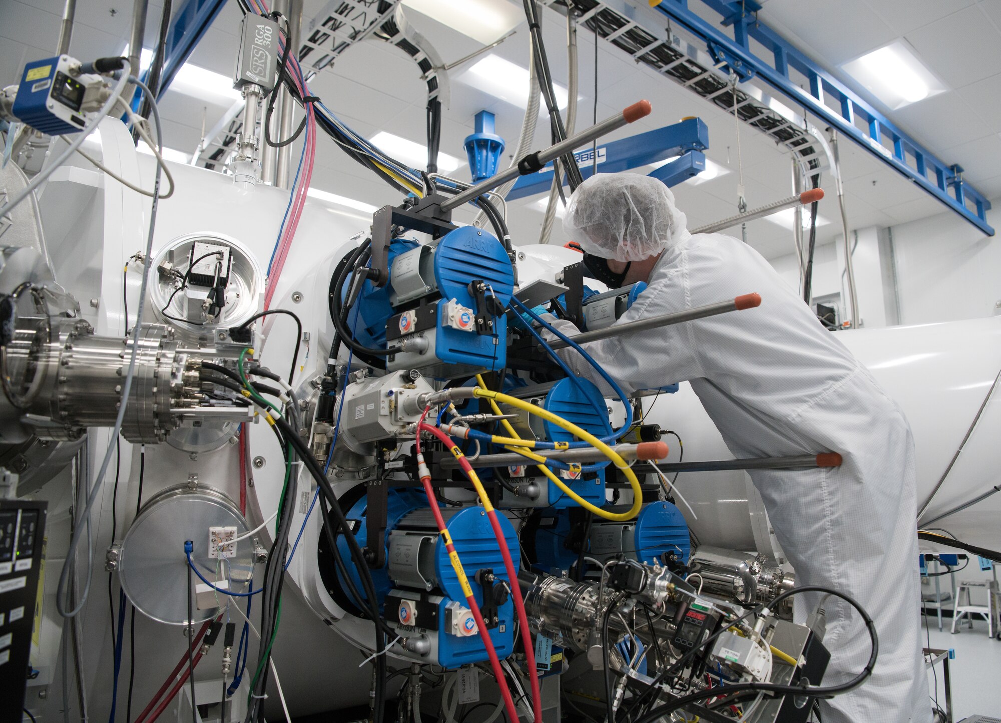 Eric D'Ambro, a test operations engineer, works on a Space Asset Resilience thermal vacuum chamber, Aug. 3, 2020, at Arnold Air Force Base, Tenn. The chamber is used to create the environment of space and then observe its effects on test articles from the environment and hazards produced by the article itself. (U.S. Air Force photo by Jill Pickett)