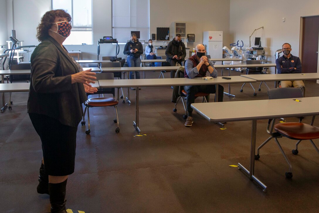 The 19th Sergeant Major of the Marine Corps, Sgt. Maj. Troy E. Black, attends a brief given by the Director of the Warrior Research Center, Dr. JoEllen Sefton at the Auburn University Athletic Complex, Dec. 1, 2020. Black met with athletic department staff to discuss the Marine Corps’ human performance goals and how some of the research, techniques and procedures used at the Auburn University Kinesiology labs can benefit the Marine Corps fitness model. Human performance is key to remaining a capable force that is ready to fight in any clime and place. (U.S. Marine Corps photo by Sgt. Victoria Ross)