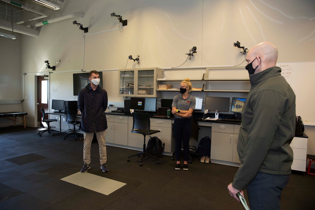 The 19th Sergeant Major of the Marine Corps, Sgt. Maj. Troy E. Black, greets Navy Reserve Officer Training Corps (ROTC) Midshipman Cole Burton, a severe vehicle accident survivor, at the Auburn University Athletic Complex, Dec. 1, 2020. Black met with athletic department staff to discuss the Marine Corps’ human performance goals and how some of the research, techniques and procedures used at the Auburn University Kinesiology labs can benefit the Marine Corps fitness model. Human performance is key to remaining a capable force that is ready to fight in any clime and place. (U.S. Marine Corps photo by Sgt. Victoria Ross)