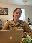 Tech. Sgt. Eunice Bivins teleworks from her home office in Salt Lake City, Utah.. Bivins is partnered with Utah County in contacting people after they receive a positive COVID-19 test.