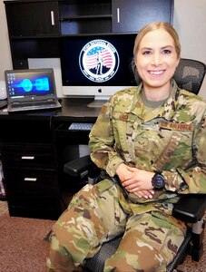 Senior Airman Nicole Ligeza is partnered with Weber-Morgan County as she teleworks from her home office contacting people after they receive a positive COVID-19 test.