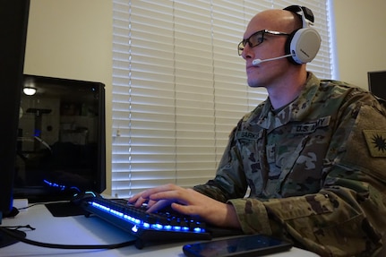 2nd Lt. Blase Barker teleworks in his home office in Salt Lake City contacting people after they receive a positive COVID-19 test.