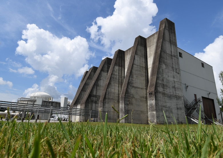 The J-6 Rocket Motor Test Facility has a large blast wall, seen in this image taken July 28, 2020, at Arnold Air Force Base, Tenn., that would deflect debris away from the base in case of an uncontrolled rocket motor explosion. Precautions are taken to minimize the possibility of such an event. (U.S. Air Force photo by Jill Pickett)