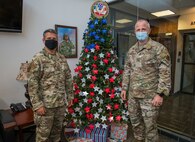U.S. Air Force Col. Matthew Allen, commander of the 24th Special Operations Wing, places a star on an Honor Tree