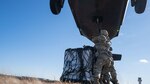 Sgts. Beqa Sabanashvili and Yorby Fenandeztejada, assigned to the 145th Support Maintenance Company, New York Army National Guard, conduct sling-load operations during training at the Army Aviation Safety Facility in Ronkonkoma, N.Y., on Nov. 24, 2020. Sling-load operations allow for the quick deployment of supplies during combat or to areas that are geographically difficult to reach during natural disasters or emergencies.
