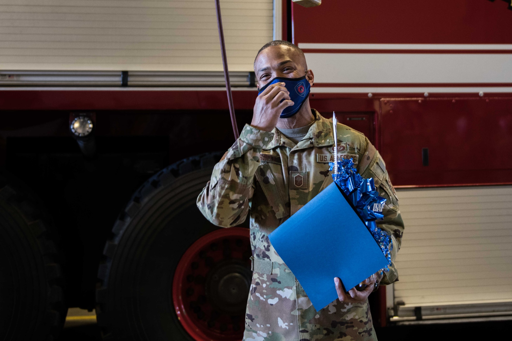 Senior Master Sgt. Shanton Russell, 22nd Civil Engineer Squadron deputy fire chief, laughs after he hears he was selected to promote Dec. 1, 2020, at McConnell Air Force Base, Kansas. Out of the 518 chief master sergeant selectees across the Air Force, two are stationed at McConnell. There was an 18.75% selection rate for this year's promotion cycle. (U.S. Air Force photo by Senior Airman Alan Ricker)