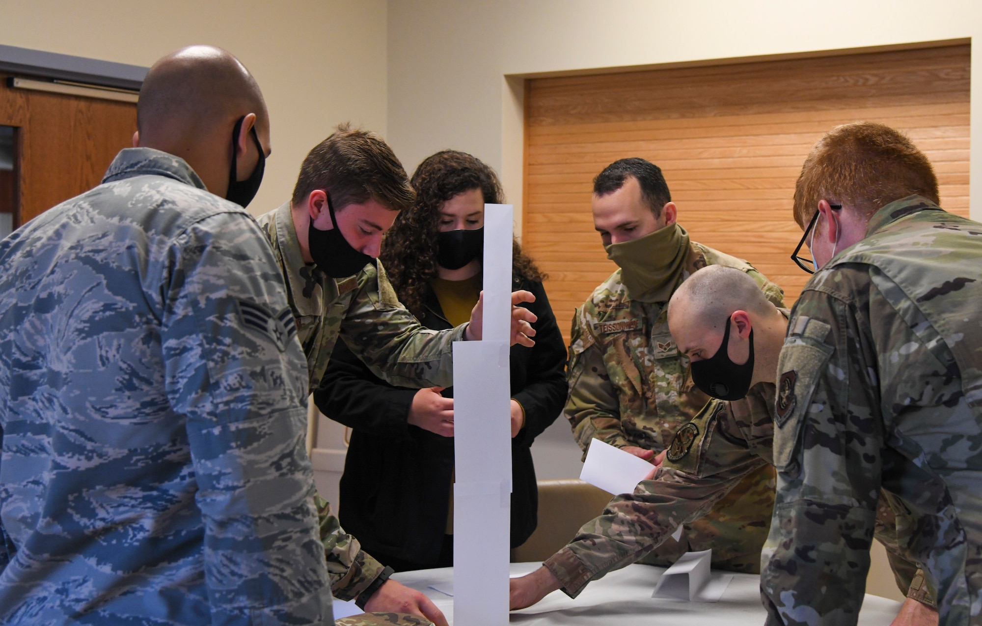 Airmen participate in a team-building exercise during an Eagles SOAR-EDU self-awareness class at Dover Air Force Base, Delaware, Oct. 22, 2020. Eagles SOAR-EDU is a professional development platform and resource hub for all Airmen and Department of Defense civilian workers at Dover Air Force Base. (U.S. Air Force photo by Airman 1st Class Stephani Barge)