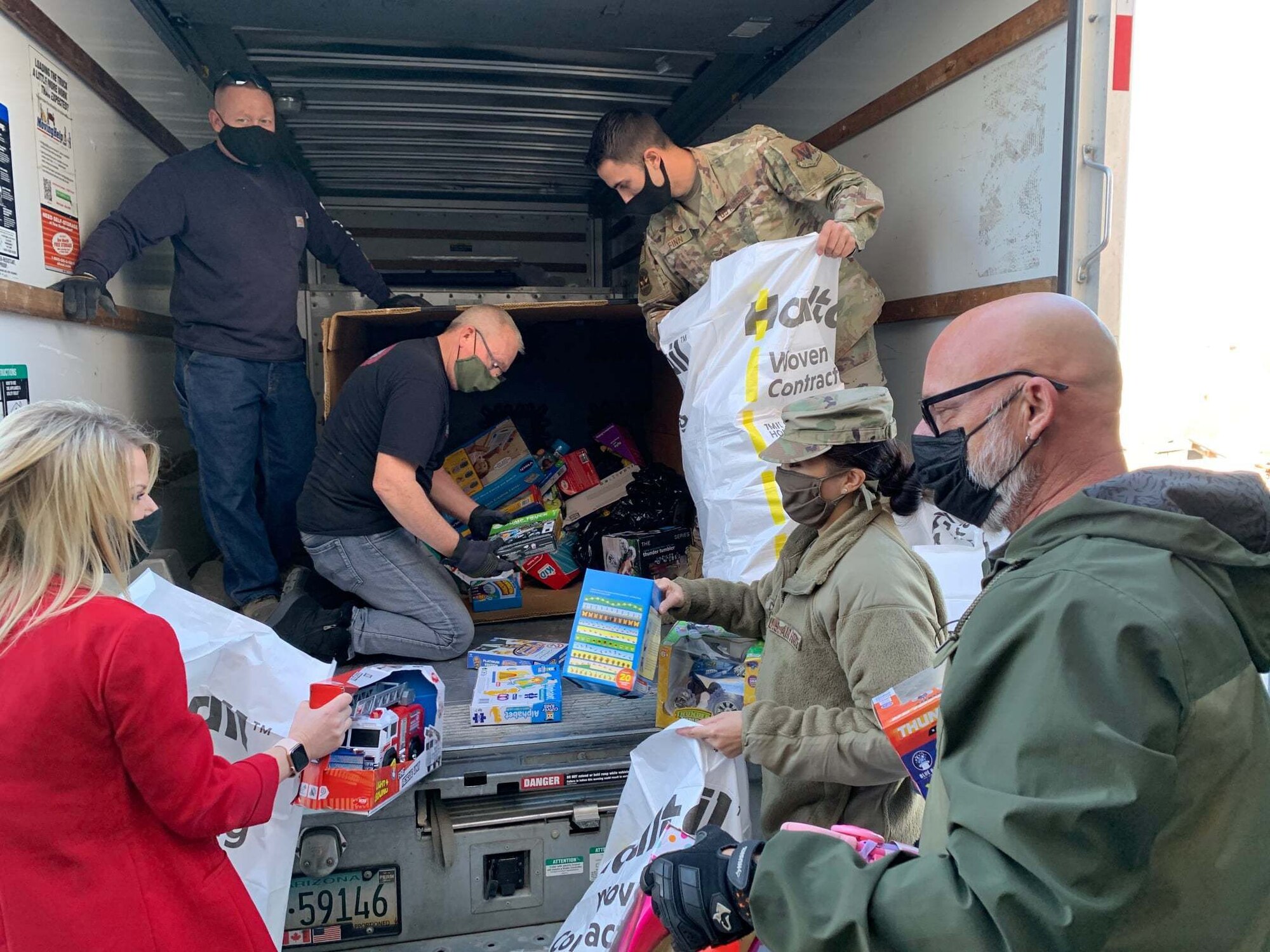 Santa’s little helpers are working hard to get ready for the 926th Wing Airman and Family Readiness Operation Holiday Hope event, Dec. 2, 2020 at Nellis Air Force Base, Nev. (U.S. Air Force photo by Natalie Stanley)