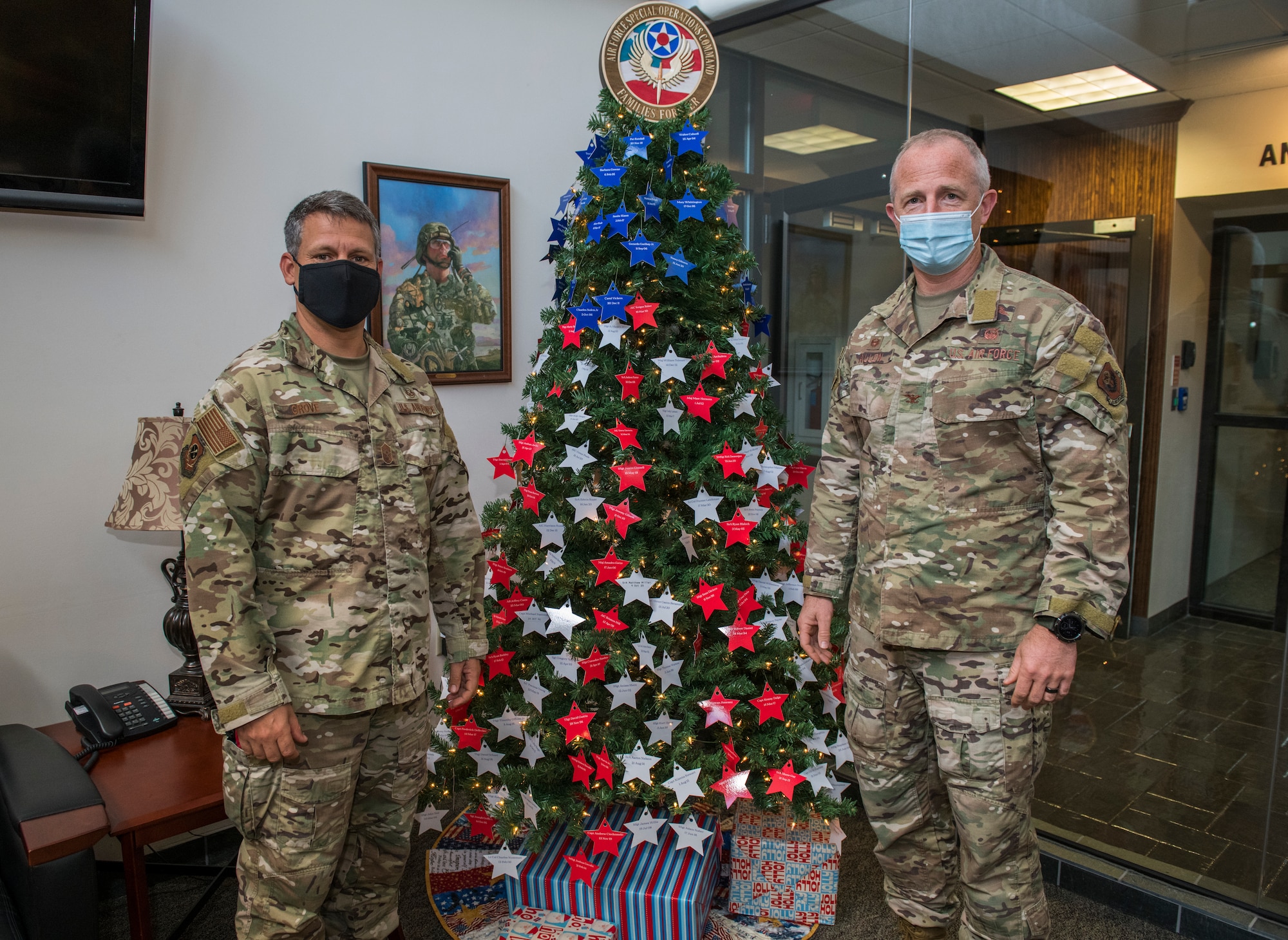 U.S. Air Force Col. Matthew Allen, commander of the 24th Special Operations Wing, places a star on an Honor Tree