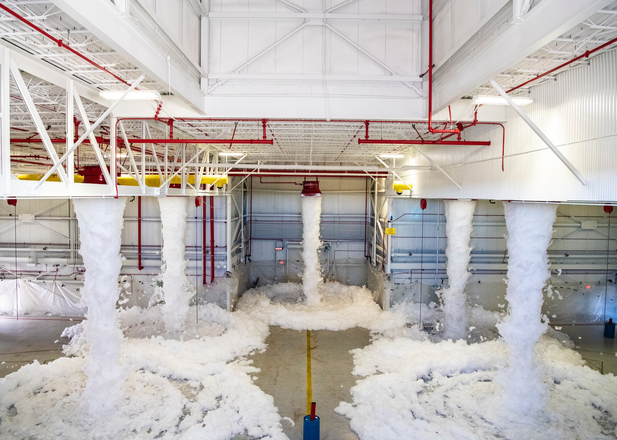 Photo of foam starting to fill the inside of a hangar