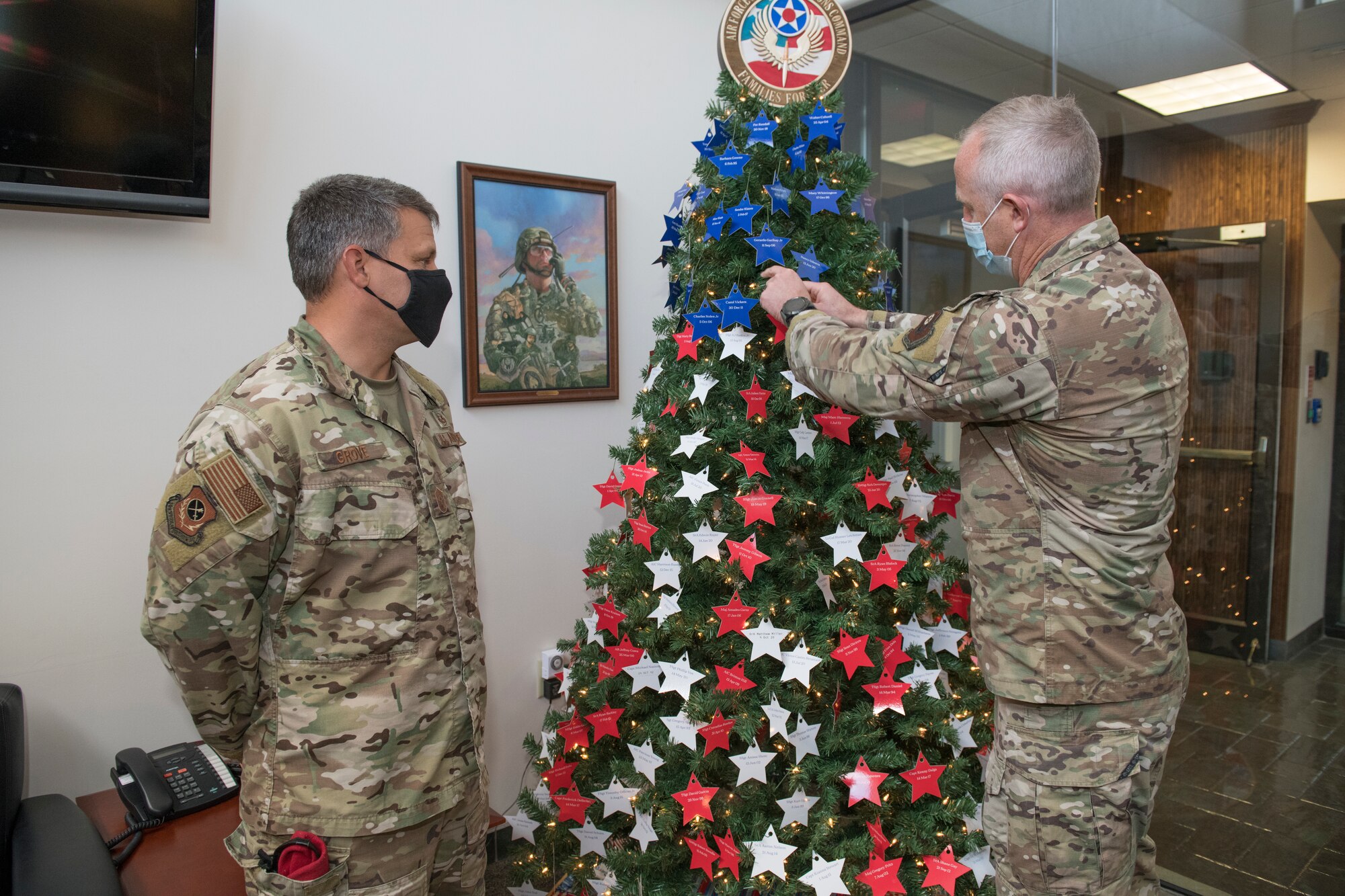 U.S. Air Force Col. Matthew Allen, commander of the 24th Special Operations Wing, places a star on an Honor Tree