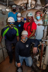 From left to right: Structural Group (Code 920) Welder Noah Claytor inside the reboiler; Structural Group (Code 920) welding group with the reboiler; Structural Group (Code 920) Welder Diamond Lee welding outside the reboiler.