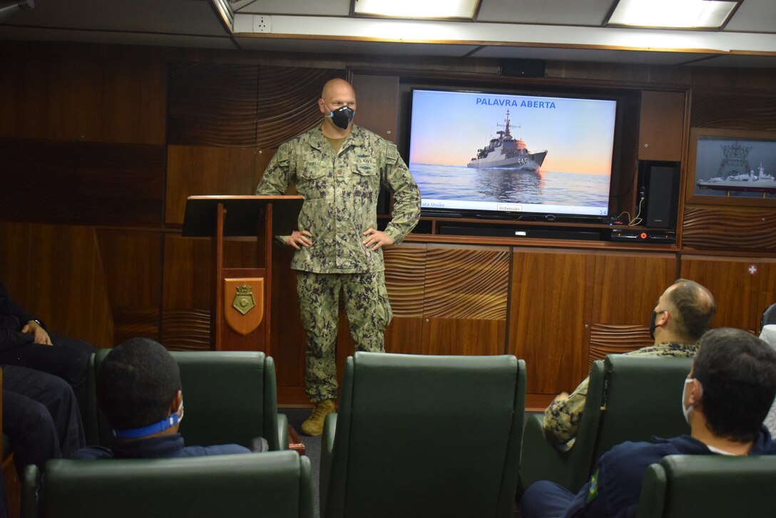 A U.S. Navy sailor introduces himself to the Brazilian Navy and Marine Corps leadership aboard the Brazilian Naval frigate Uniâo (F 45), Oct. 27.