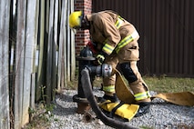 Airman 1st Class Hedrige Evra, a firefighter for the 628th Civil Engineer Squadron, connects a firehose to a fire hydrant to ensure water flows correctly through the hose, at Joint Base Charleston, S.C., Dec. 3, 2020. Swift and his team members at the 628th CES Fire Department support the mission by saving lives and protecting the people of Joint Base Charleston.