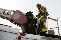 Danny Drake, a firefighter from the 628th Civil Engineer Squadron, begins to extend a hydraulic operated aerial ladder to a nearby training building to begin the process of ascending the building safely, at Joint Base Charleston, S.C., Dec. 3, 2020. Swift and his team members at the 628th CES Fire Department support the mission by saving lives and protecting the people of Joint Base Charleston.