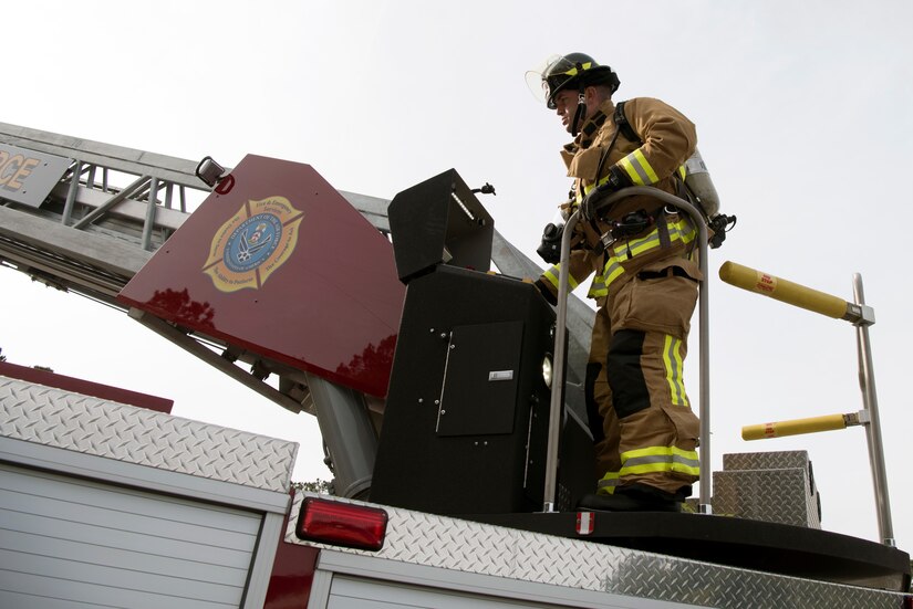 Danny Drake, a firefighter from the 628th Civil Engineer Squadron, begins to extend a hydraulic operated aerial ladder to a nearby training building to begin the process of ascending the building safely, at Joint Base Charleston, S.C., Dec. 3, 2020. Swift and his team members at the 628th CES Fire Department support the mission by saving lives and protecting the people of Joint Base Charleston.