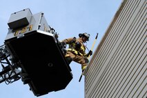 Chaz Cools, a firefighter from the 628th Civil Engineer Squadron, begins to mount himself to the top of the training building, at Joint Base Charleston, S.C., Dec. 3, 2020. Swift and his team members at the 628th CES Fire Department support the mission by saving lives and protecting the people of Joint Base Charleston.