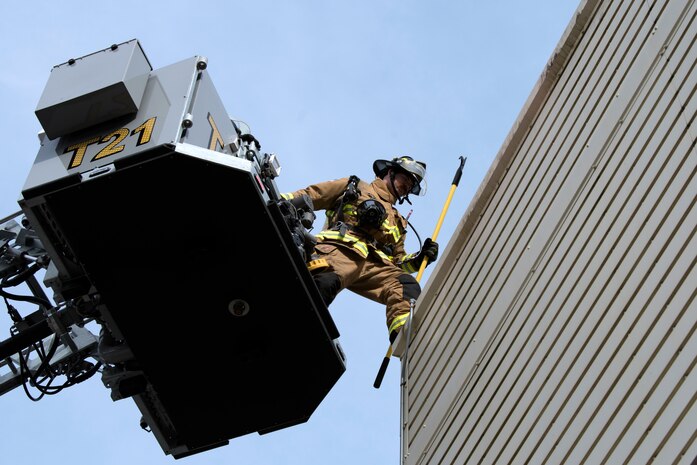 Chaz Cools, a firefighter from the 628th Civil Engineer Squadron, begins to mount himself to the top of the training building, at Joint Base Charleston, S.C., Dec. 3, 2020. Swift and his team members at the 628th CES Fire Department support the mission by saving lives and protecting the people of Joint Base Charleston.