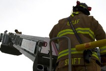 Christopher Swift, a driver operator from the 628th Civil Engineer Squadron, monitors Airmen and civilians operating during a training exercise, at Joint Base Charleston, S.C., Dec. 3, 2020. Swift and his team members at the 628th CES Fire Department support the mission by saving lives and protecting the people of Joint Base Charleston.