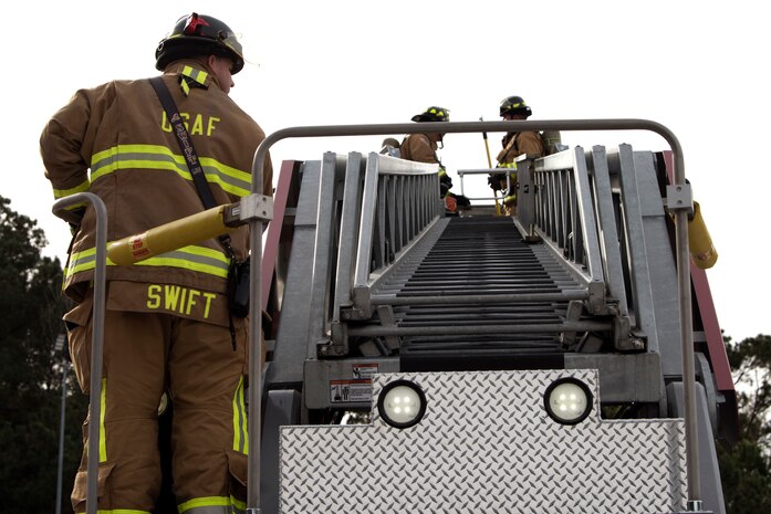 Christopher Swift, a driver operator from the 628th Civil Engineer Squadron, monitors Airmen and civilians operating during a training exercise, at Joint Base Charleston, S.C., Dec. 3, 2020. Swift and his team members at the 628th CES Fire Department support the mission by saving lives and protecting the people of Joint Base Charleston.