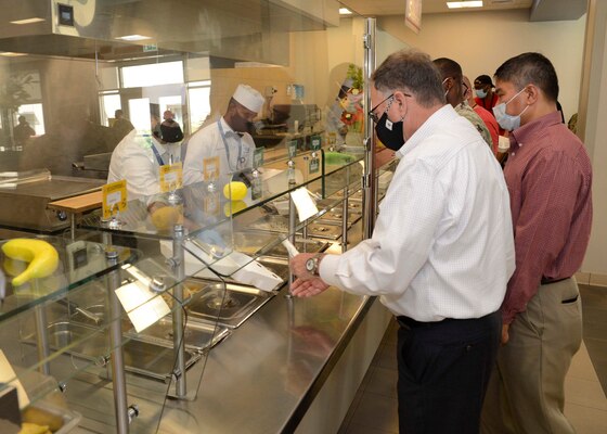 Assistant Secretary of the Navy (Energy, Installations and Environment) Charles Williams, Jr., is served lunch at the base galley during a tour of Naval Support Activity (NSA) Bahrain.