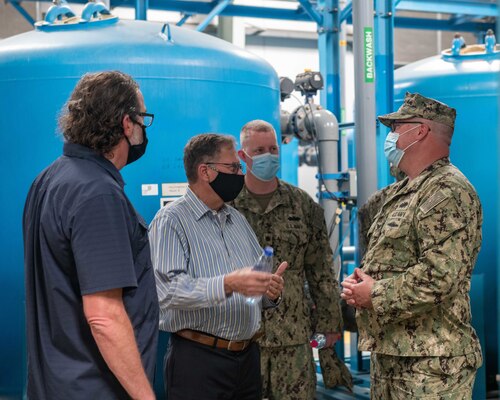 Assistant Secretary of the Navy for Energy, Installations and Environment Charles Williams Jr., center left, speaks with members of Camp Lemonnier, Djibouti (CLDJ), Public Works Department during a tour of facilities on base.