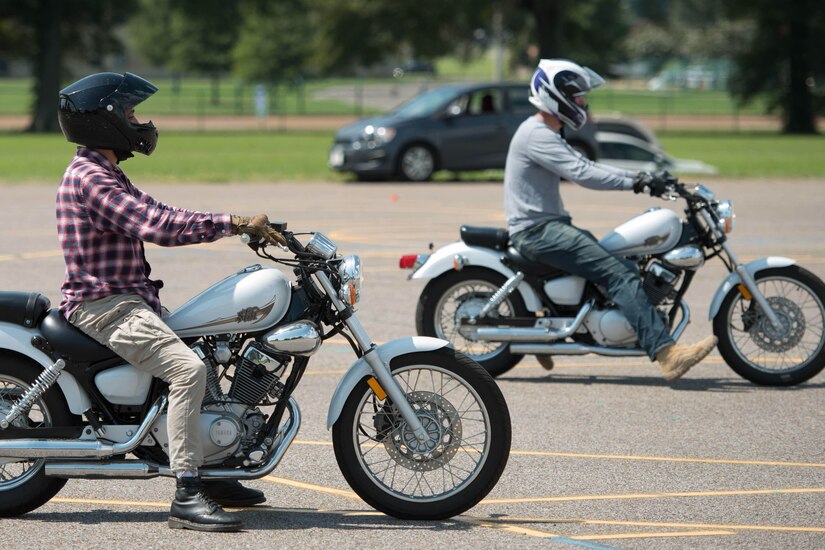 Students ride motorcycles.