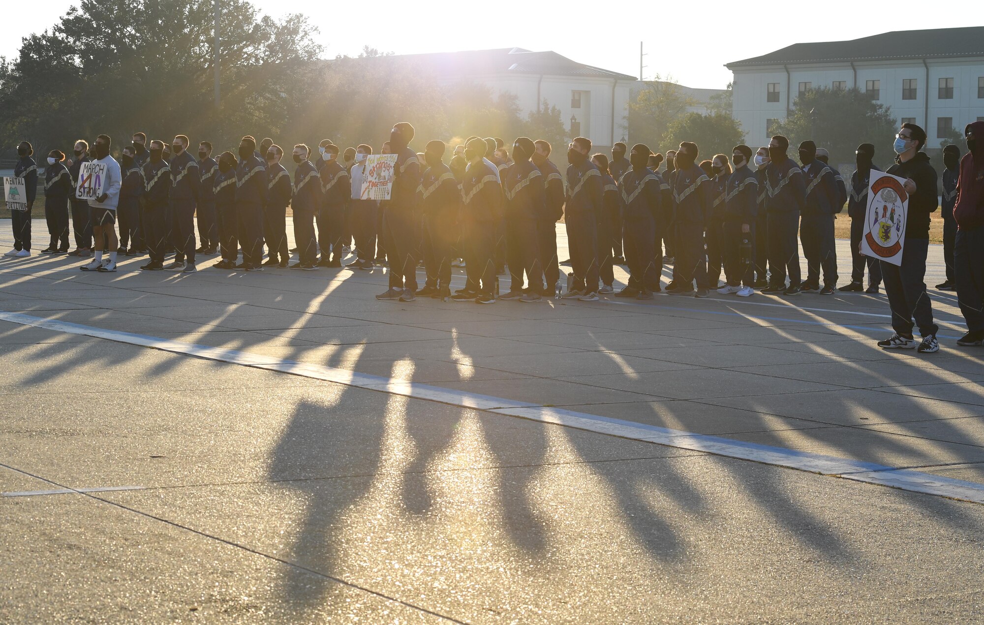 Airmen from the 81st Training Group stand in formation on the Levitow Training Support Facility drill pad during the Dragon March at Keesler Air Force Base, Mississippi, Dec. 8, 2020. The theme of the three-mile walk was "Stronger Together." (U.S. Air Force photo by Kemberly Groue)