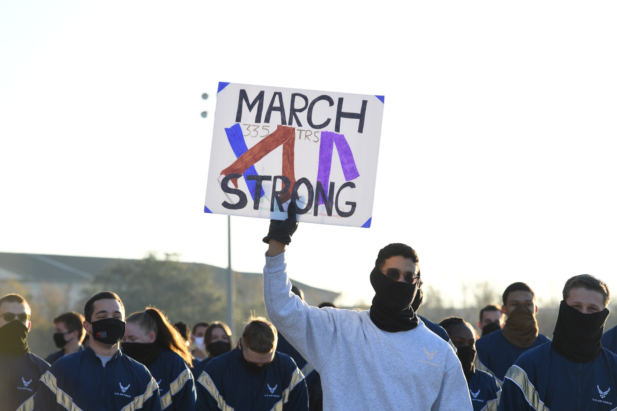 Airmen from the 81st Training Group participate in the Dragon March on the Levitow Training Support Facility drill pad at Keesler Air Force Base, Mississippi, Dec. 8, 2020. The theme of the three-mile walk was "Stronger Together." (U.S. Air Force photo by Kemberly Groue)