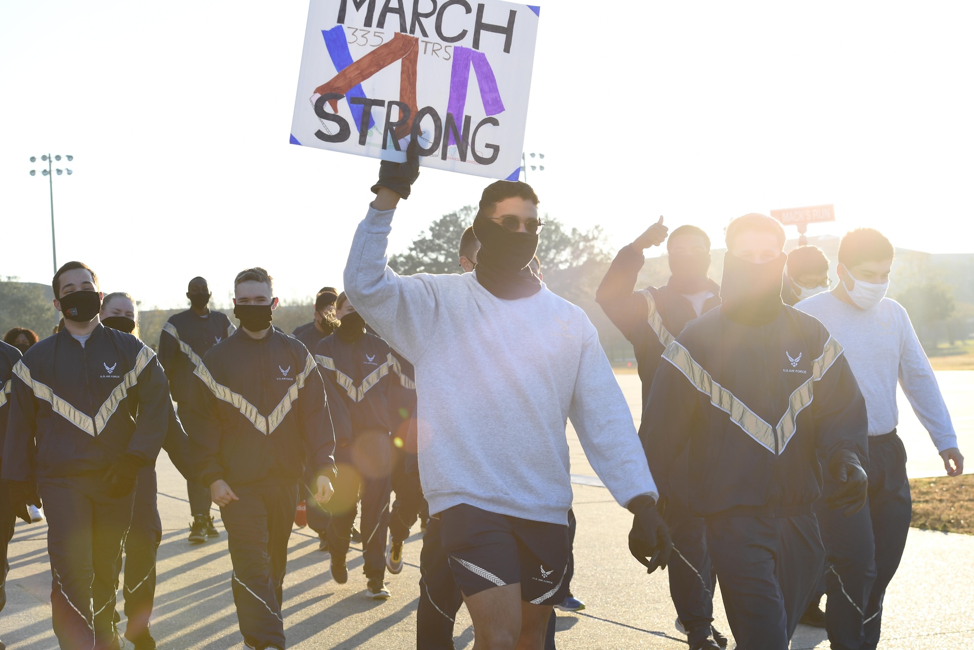Airmen from the 81st Training Group participate in the Dragon March on the Levitow Training Support Facility drill pad at Keesler Air Force Base, Mississippi, Dec. 8, 2020. The theme of the three-mile walk was "Stronger Together." (U.S. Air Force photo by Kemberly Groue)