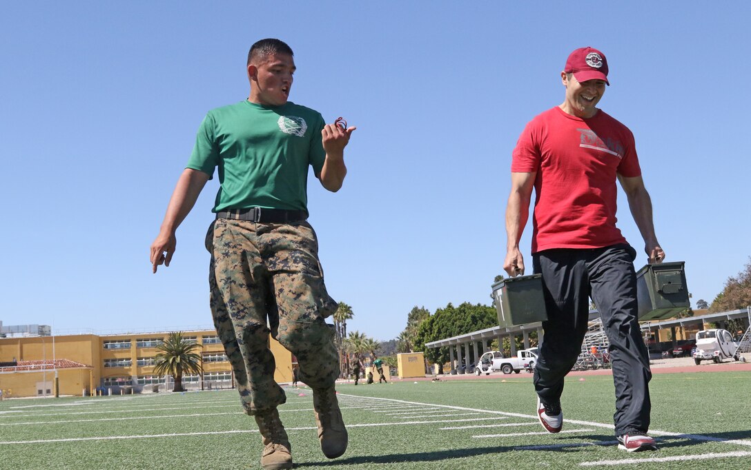 Marine Corps Sgt. Kelvin Gonzalez calls out Vitali Andreev's time during a combat fitness test at Marine Corps Recruit Depot San Diego, June 13, 2017. Andreev is a teacher for Rosary Academy in Fullerton, Calif., and attended this year's Educators Workshop to get a once in a lifetime, candid look into the U.S. Marine Corps. This all-expense paid workshop immerses teachers, coaches, counselors, principals and band directors into the unknowns of the organization so they may broaden their perspective and pass their experience and knowledge onto their students.