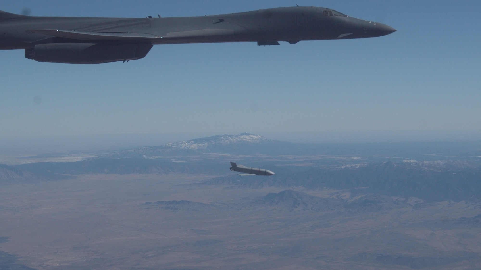 A B-1B Lancer assigned to the 419th Flight Test Squadron, 412th Test Wing, releases a Joint Air-to-Surface Standoff Missile during an external release demonstration in the skies over Holloman Air Force Base, New Mexico, Dec. 4. (Air Force photo by Ethan Wagner)