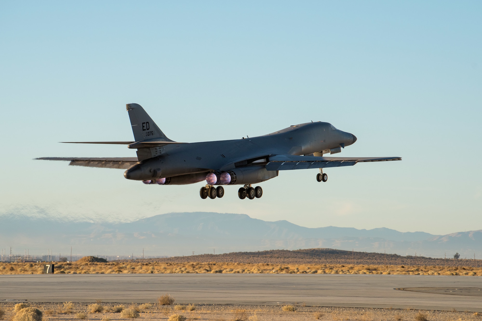 A B-1B Lancer assigned to the 419th Flight Test Squadron, 412th Test Wing, takes off from Edwards Air Force Base, California, Dec. 4. The mission’s flight crew conducted an external release demonstration with a Joint Air-to-Surface Standoff Missile attached to an external pylon. (Air Force photo by Richard Gonzales)