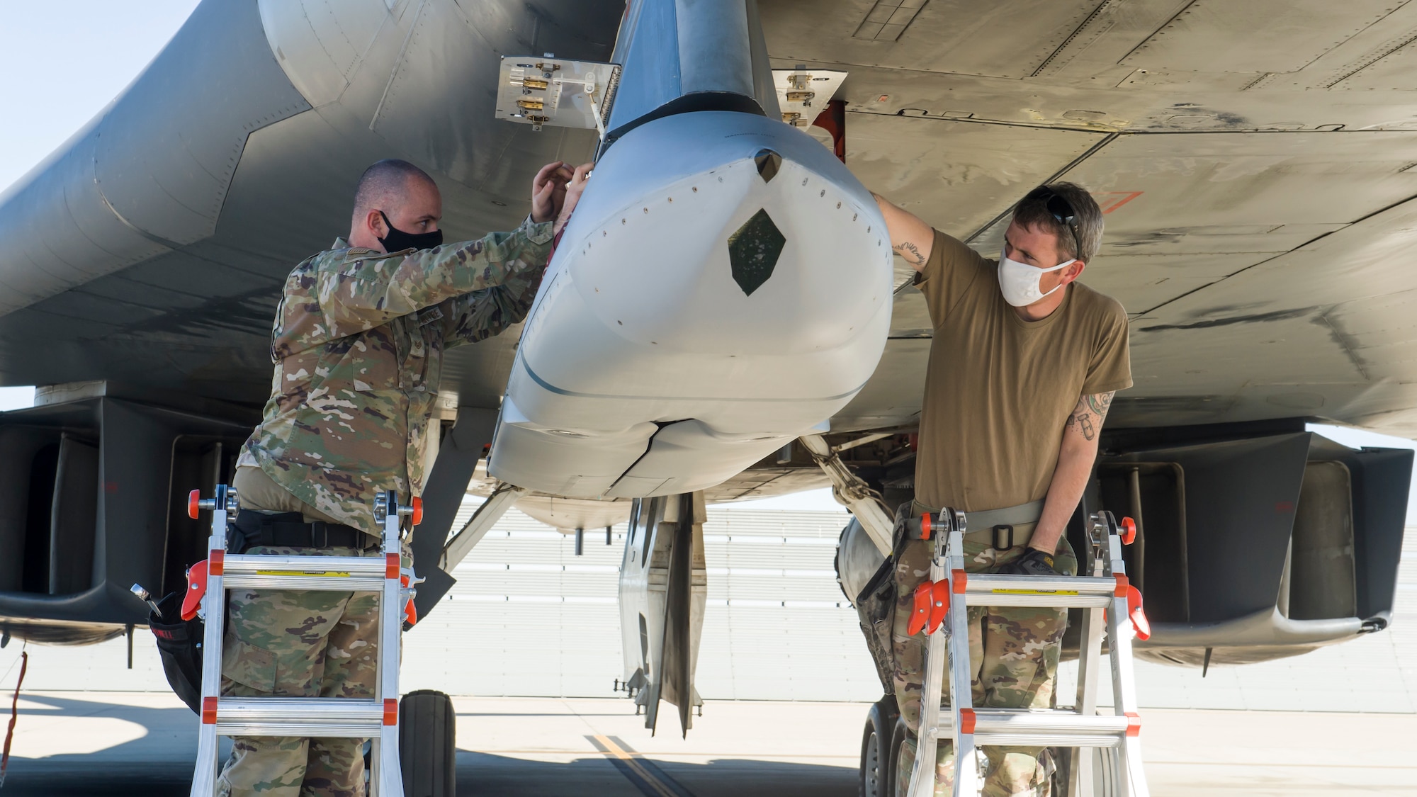 A weapon Loader crew uploads a Joint Air-to-Surface Standoff Missile to an external pylon on a B-1B Lancer at Edwards Air Force Base, California, Dec. 2. The Lancer successfully conducted an external release demonstration of the JASSM using the pylon in the skies over Holloman Air Force Base, New Mexico, Dec. 4. (Air Force photo by Joshua Miller)