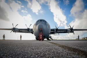 Airmen from the 374th Aircraft Maintenance Squadron out of Yokota Air Base, Japan, inspect the propellers of a C-130J Super Hercules during Operation Christmas Drop 2020 at Andersen Air Force Base, Guam, Dec. 9.