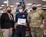 Wade Robinson, Jr., center, Army & Air Force Exchange Service (AAFES) Express staff member, receives the Hero Award from Col. Mark Dmytryszyn, right, 2nd Bomb Wing commander, and Barbara Vaught, left, AAFES general manager assistant, at Barksdale Air Force Base, La., Dec. 1, 2020.