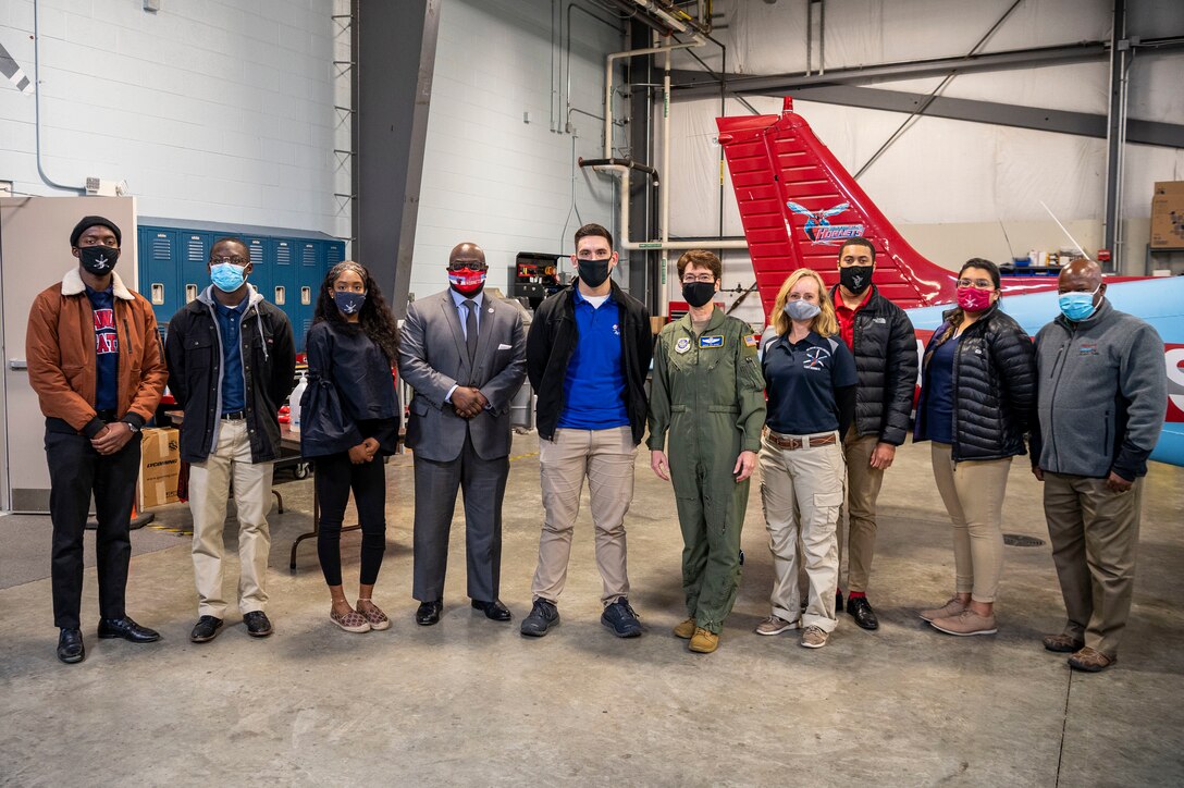 Gen. Jacqueline Van Ovost, Air Mobility Command commander, and attendees pose for a group photo at a civic engagement during her visit to Delaware Air Park, Chesworld, Delaware, Dec. 8, 2020. Dover AFB helps foster robust relationships with AMC leaders, state legislators and local communities, promoting collaborative partnerships and efforts in support of Total Force mobility.  (U.S. Air Force photo by Senior Airman Christopher Quail)