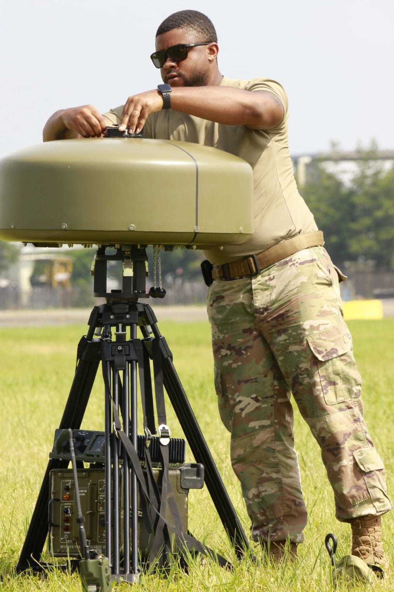 Staff Sgt. Justice Grant, 374th Operations Support Squadron NCOIC of airfield management operations sets up the TRN-41 mobile Tactical Air Navigation system during an Agile Combat Employment proof-of-concept demonstration at Yokota Aug. 19, 2020. Airmen from across the OSS set-up, flyability checked, and operationalized a refurbished mobil Tactical Air Navigation system for use in under an hour. (Courtesy photo by Capt. Arie Church)