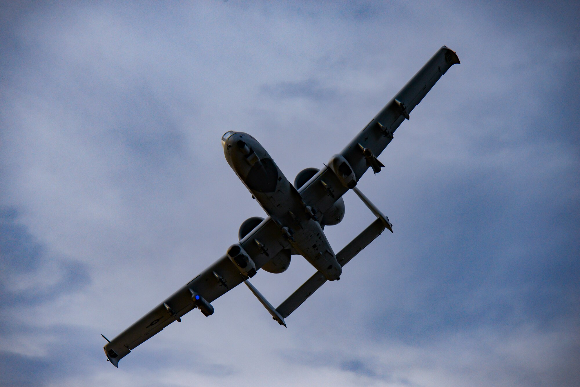 A photo of an A-10 Thunderbolt II flying over the Warren Grove Gunnery Range