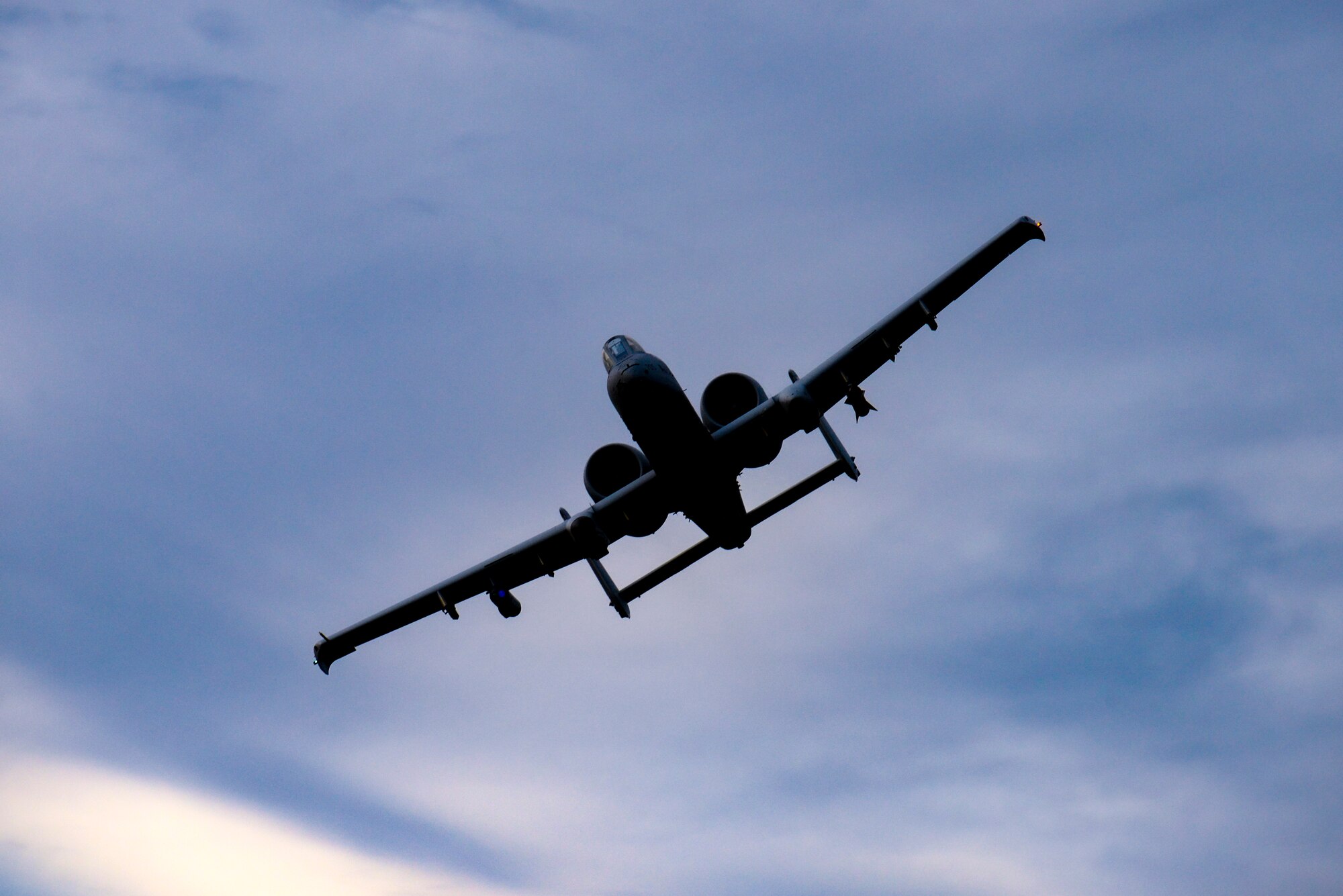 A photo of an A-10 Thunderbolt II flying over the Warren Grove Gunnery Range