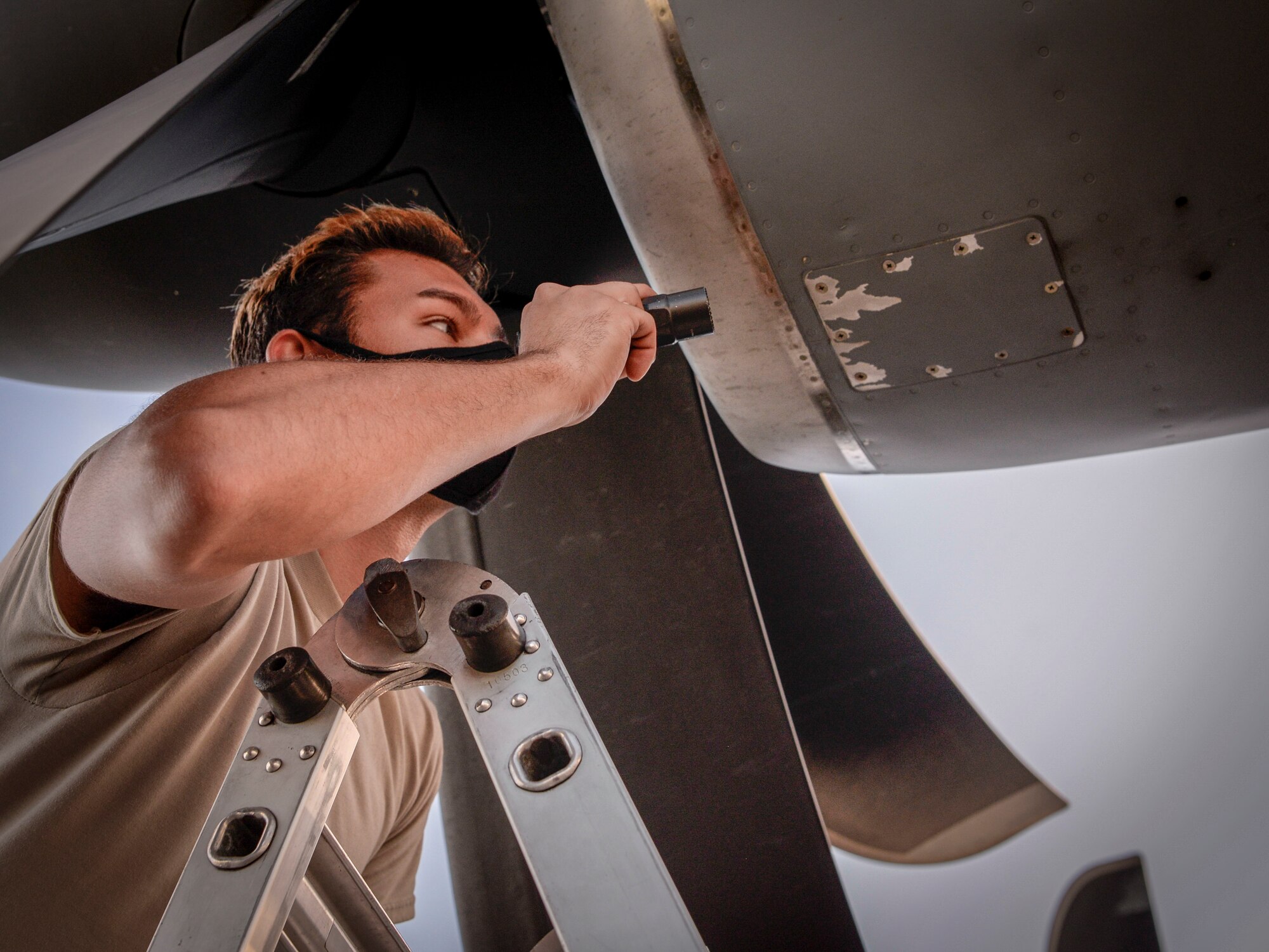 Senior Airman Stephen Yarbrough, 374th Aircraft Maintenance Squadron crew chief Yokota Air Base, Japan, inspects the engine of a C-130J Super Hercules during Operation Christmas Drop 2020 at Andersen Air Force Base, Guam, Dec. 9.