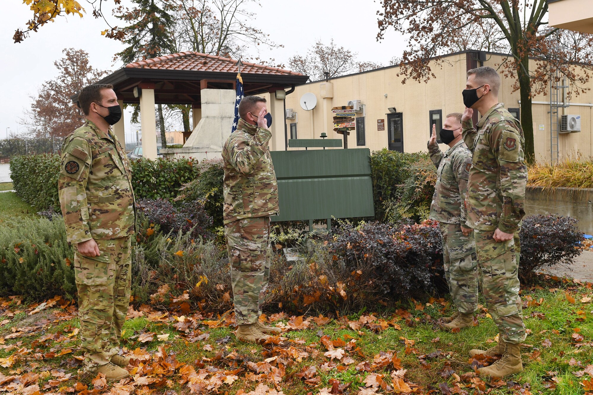 U.S. Air Force Lt. Col. Brian Robertson, 606th Air Control Squadron commander, administers the oath of enlistment to Senior Master Sgt. Sean Winters, 606th ACS cyber operations and maintenance superintendent, and Senior Master Sgt. Paul Norris, 606th ACS cyber operations and maintenance operations superintendent, as they transfer into the U.S. Space Force at Aviano Air Base Italy, Dec. 3, 2020. Winters and Norris were the first Airmen to enlist into the U.S. Space Force while stationed at Aviano.