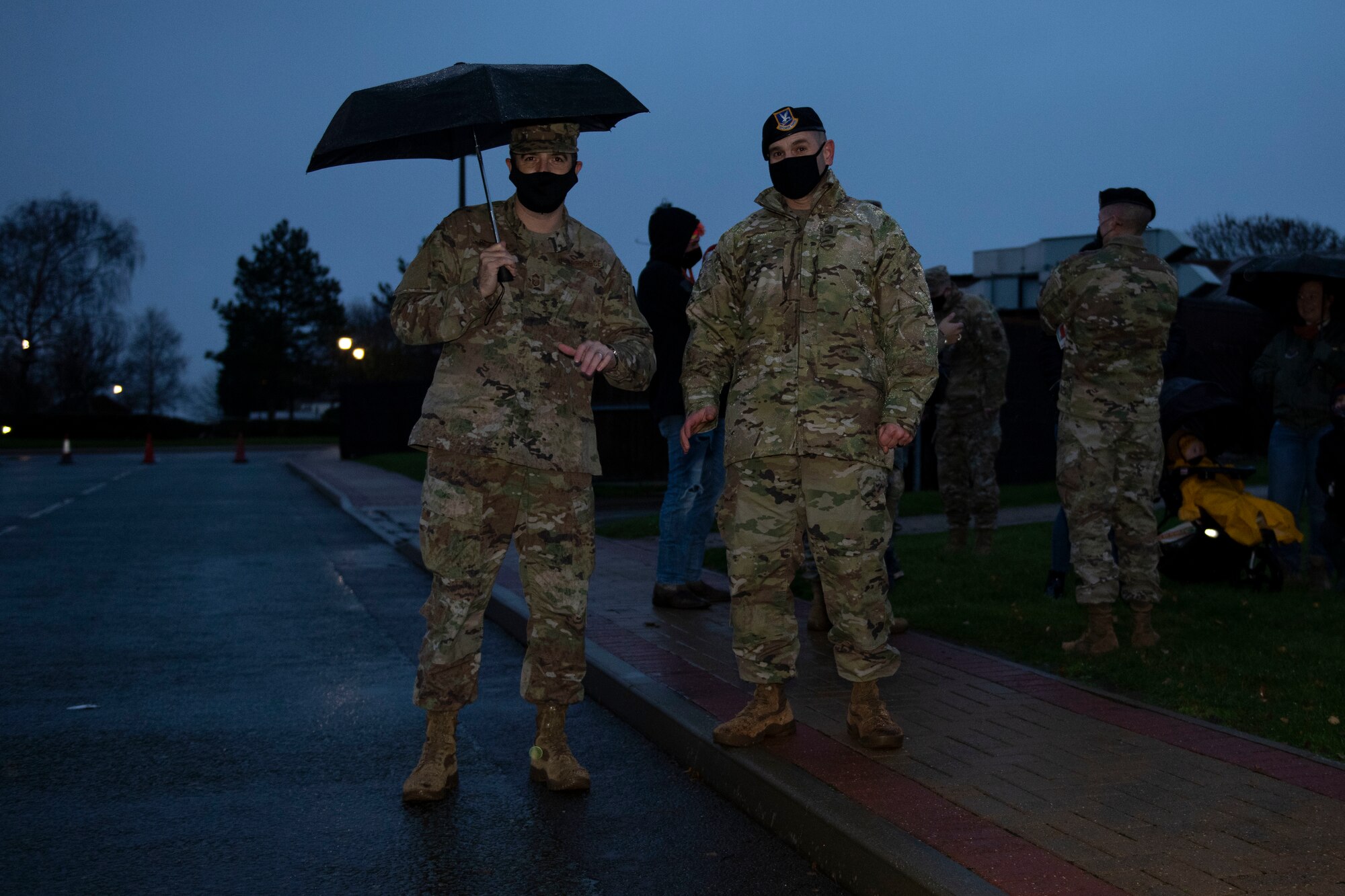 U.S. Army Col. Brian Dunmire, right, U.S. Africa Command Directorate for Intelligence at RAF Molesworth multi-service commander, and U.S. Air Force Chief Master Sgt. Dan Spencer, left, AFRICOM senior enlisted leader, pose for a photo at a tree lighting ceremony at RAF Alconbury, England, Dec. 4, 2020. Col. Kurt Wendt, 501 CSW commander, and Chief Master Sgt. Daniel Keene, 501 CSW command chief, lit the tree with Santa Clause. (U.S. Air Force photo by Senior Airman Jennifer Zima)