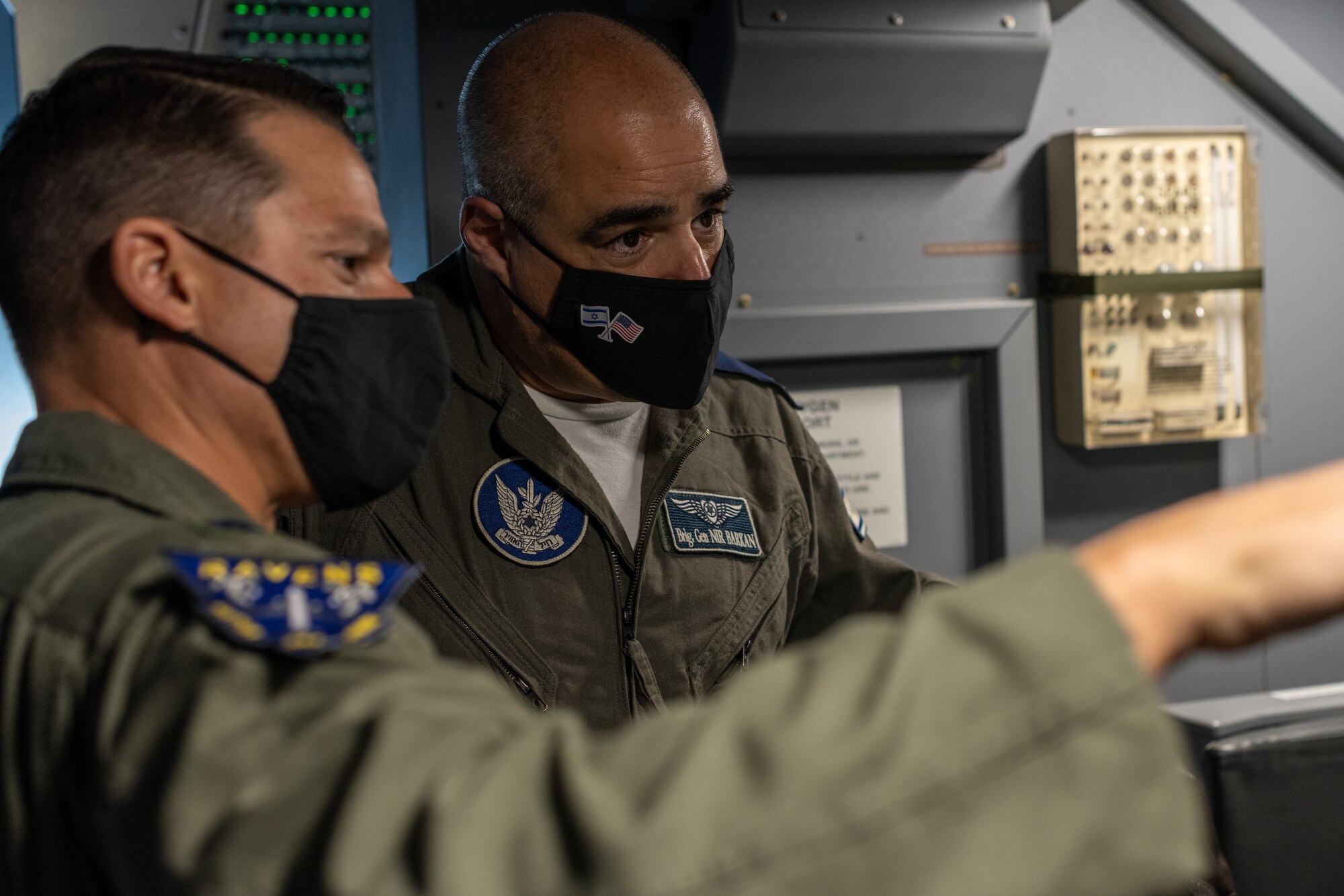 Lt. Col. Theodore Fisher, 344th Air Refueling Wing operations officer, introduces Brig. Gen. Nir Barkan, Israeli Air Force Chief of the Air Staff and Vice Commander, to the KC-46A Pegasus air refueling operator station during an in-flight tour from Joint Base Andrews, Maryland to McConnell Air Force Base, Kansas Dec. 8, 2020.