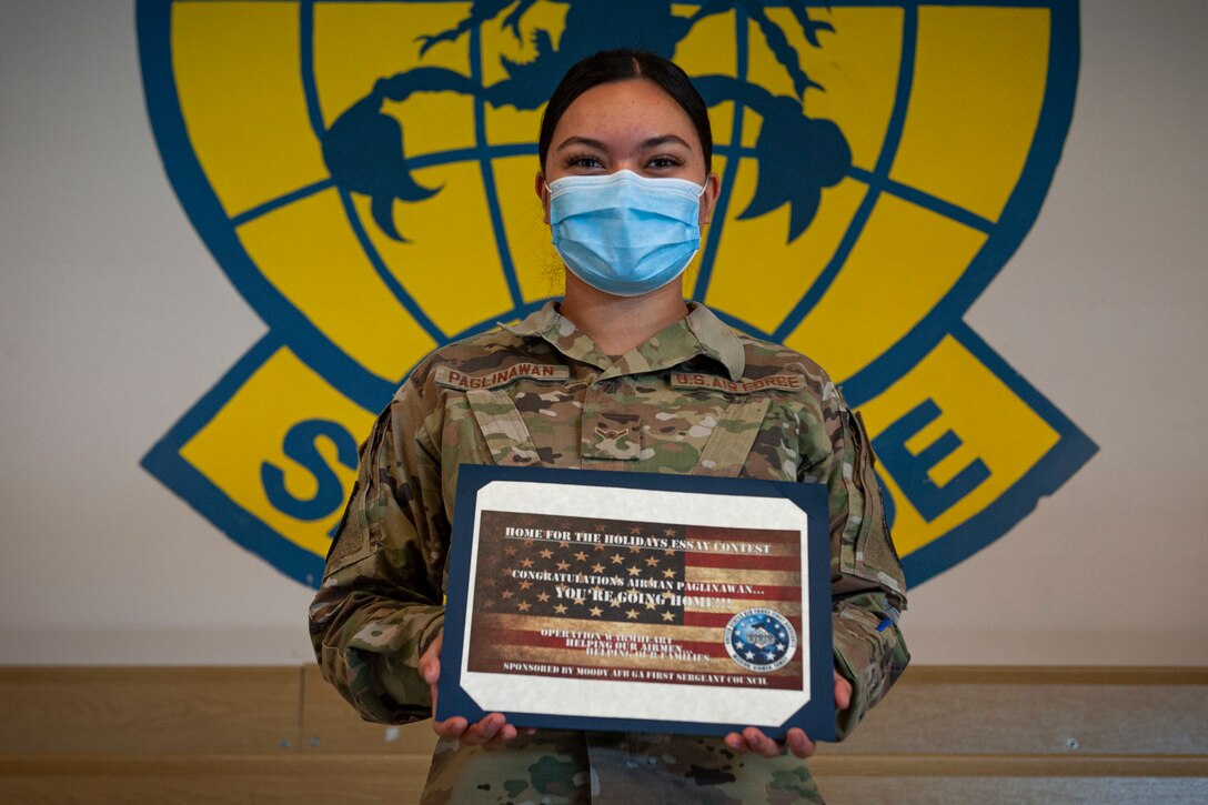 Photo of an Airman with an award