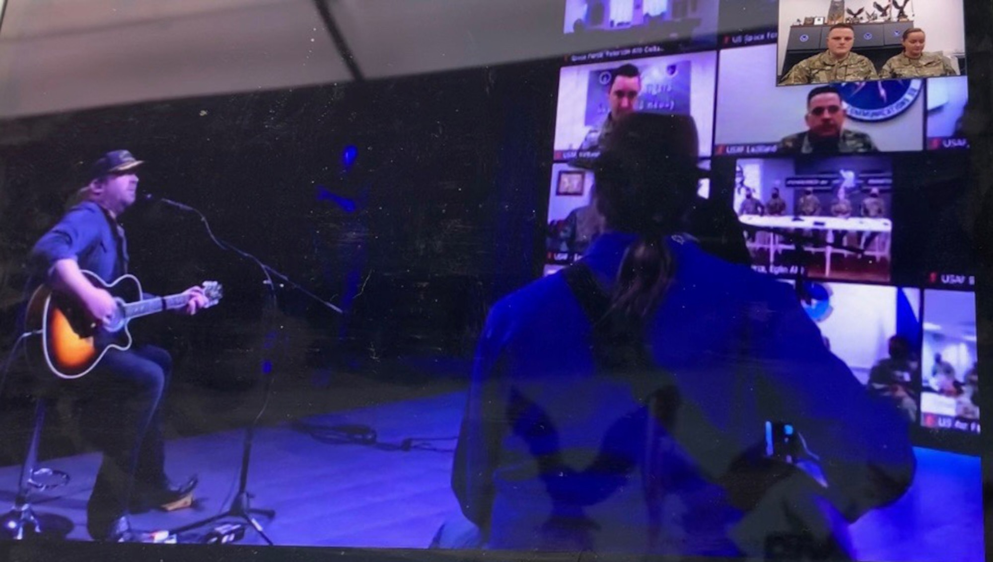 Tech. Sgt. Dexter Tapley, 361st Recruiting Squadron in Fairbanks, Alaska, and his wife Elizabeth (top right corner) during the taping of the Country Music Television Hot 20 Holiday Salute.
